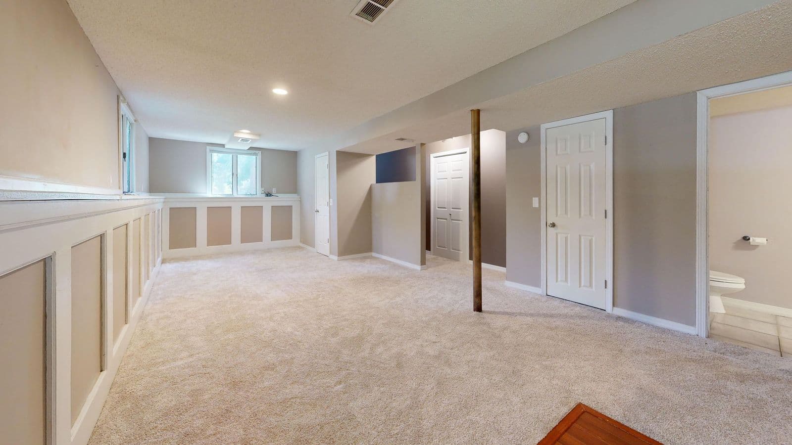 Long family room with built-in storage