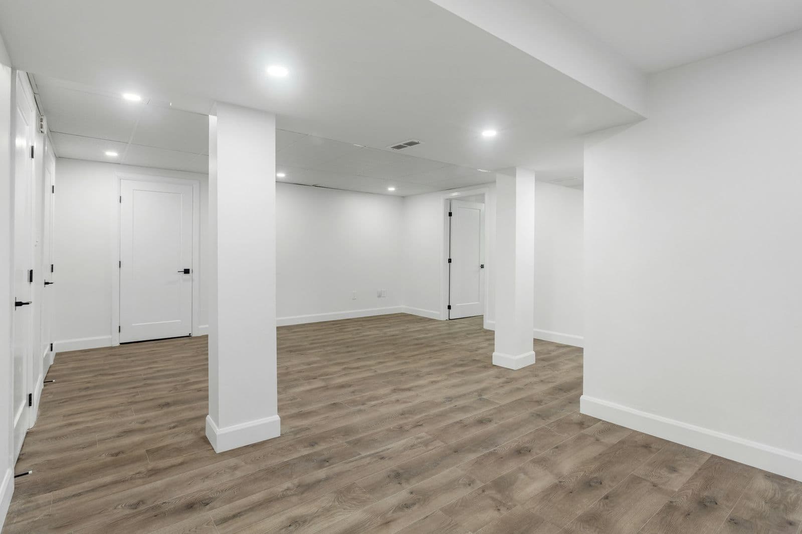 Open basement with vinyl plank floors