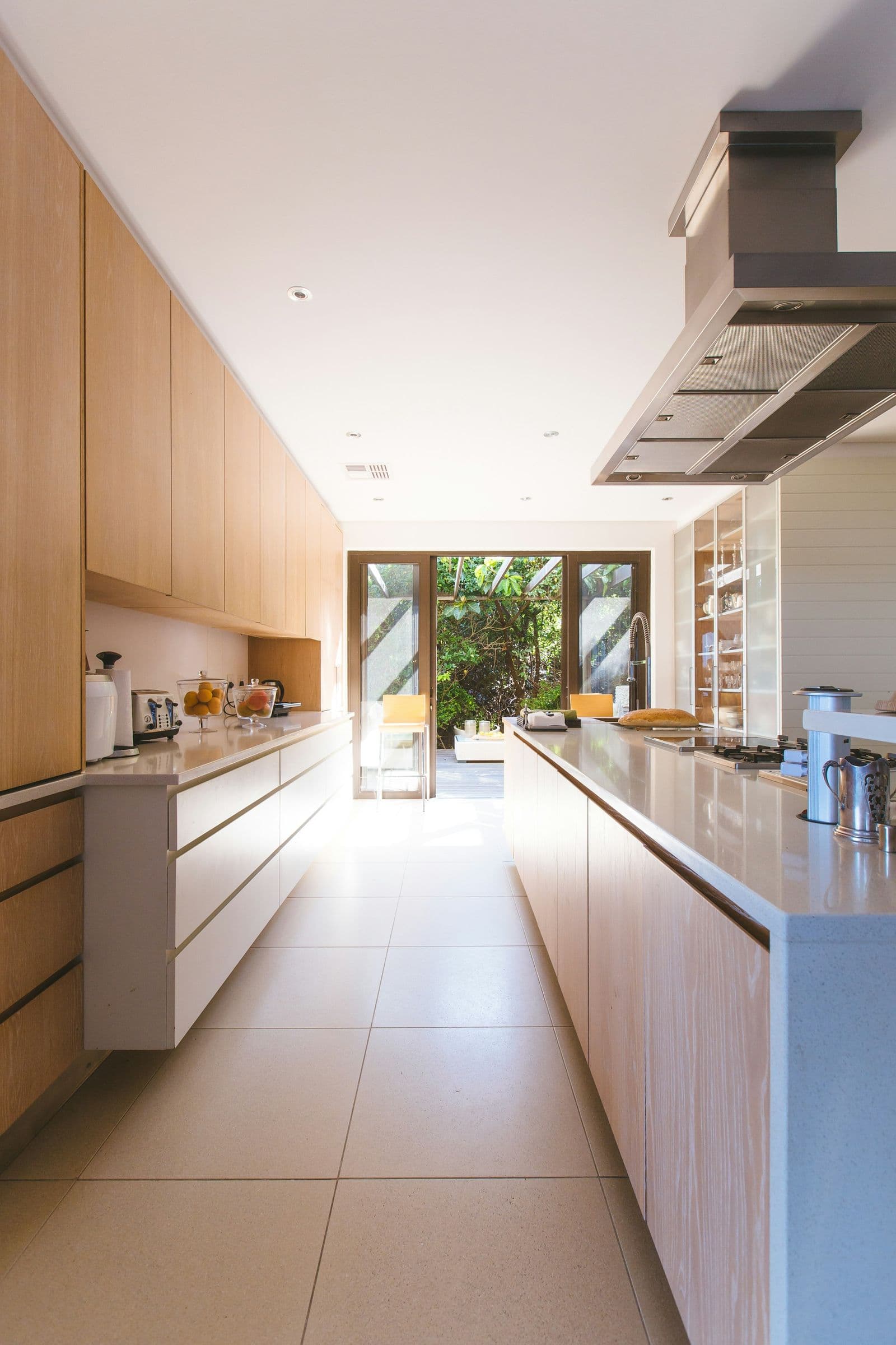 Painted cabinetry beside a glass-panel door