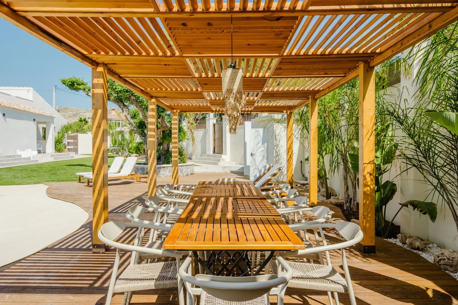 Cedar pergola over an outdoor dining table